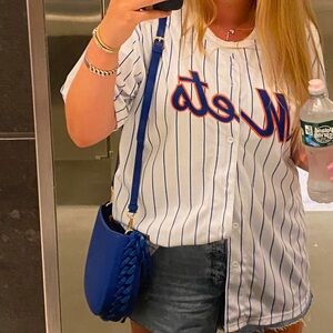 Blue purse with blue chain detailing